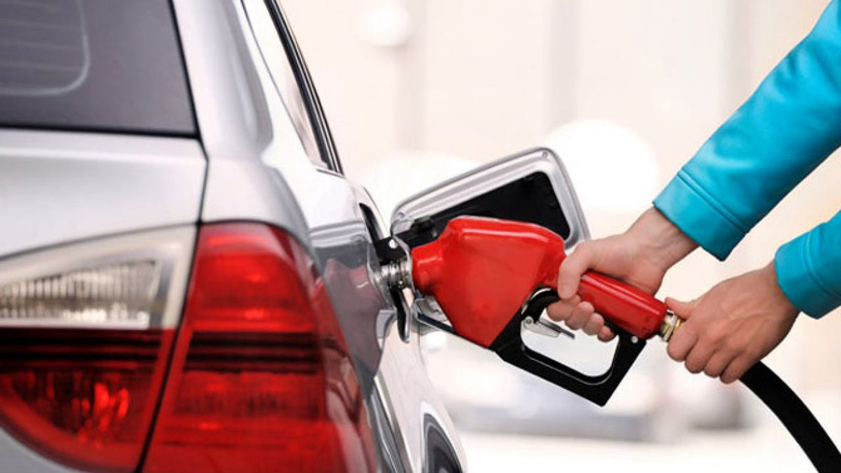 Petrol nozzle refuelling a car